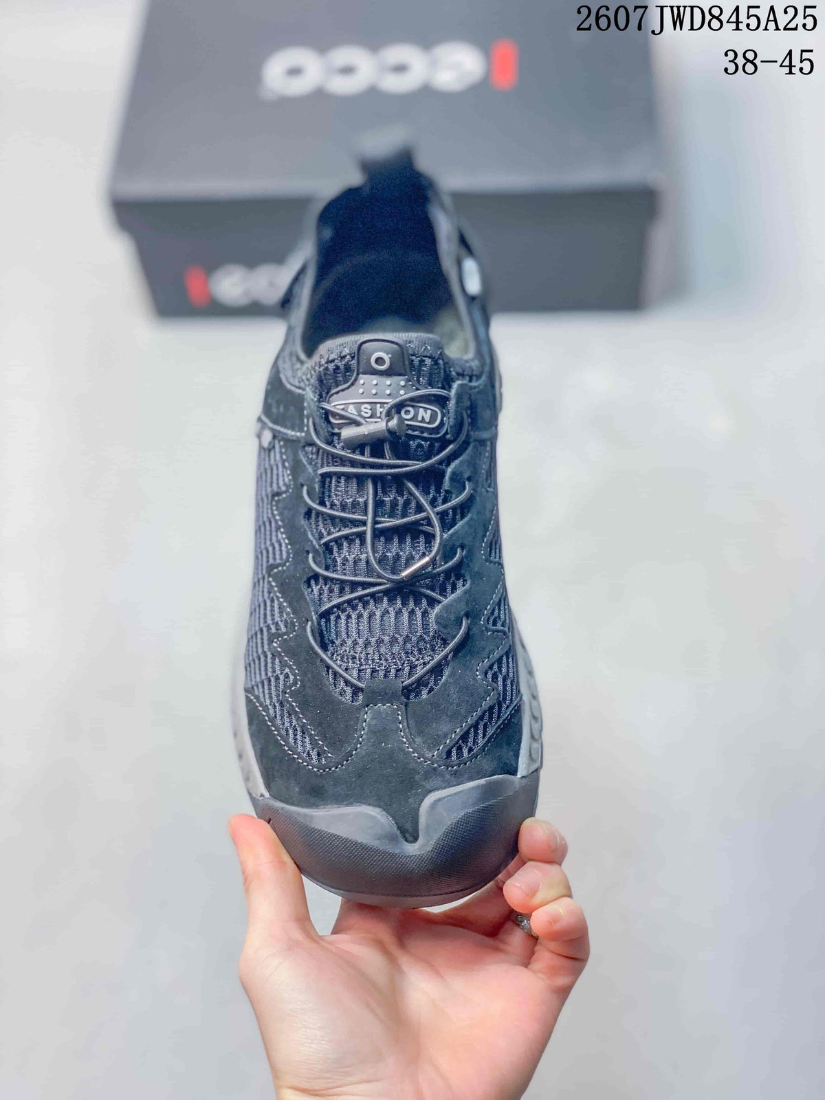 Top view of the dark ECCO sneaker showing the mesh toe box, lace-up closure, and layered upper panels.