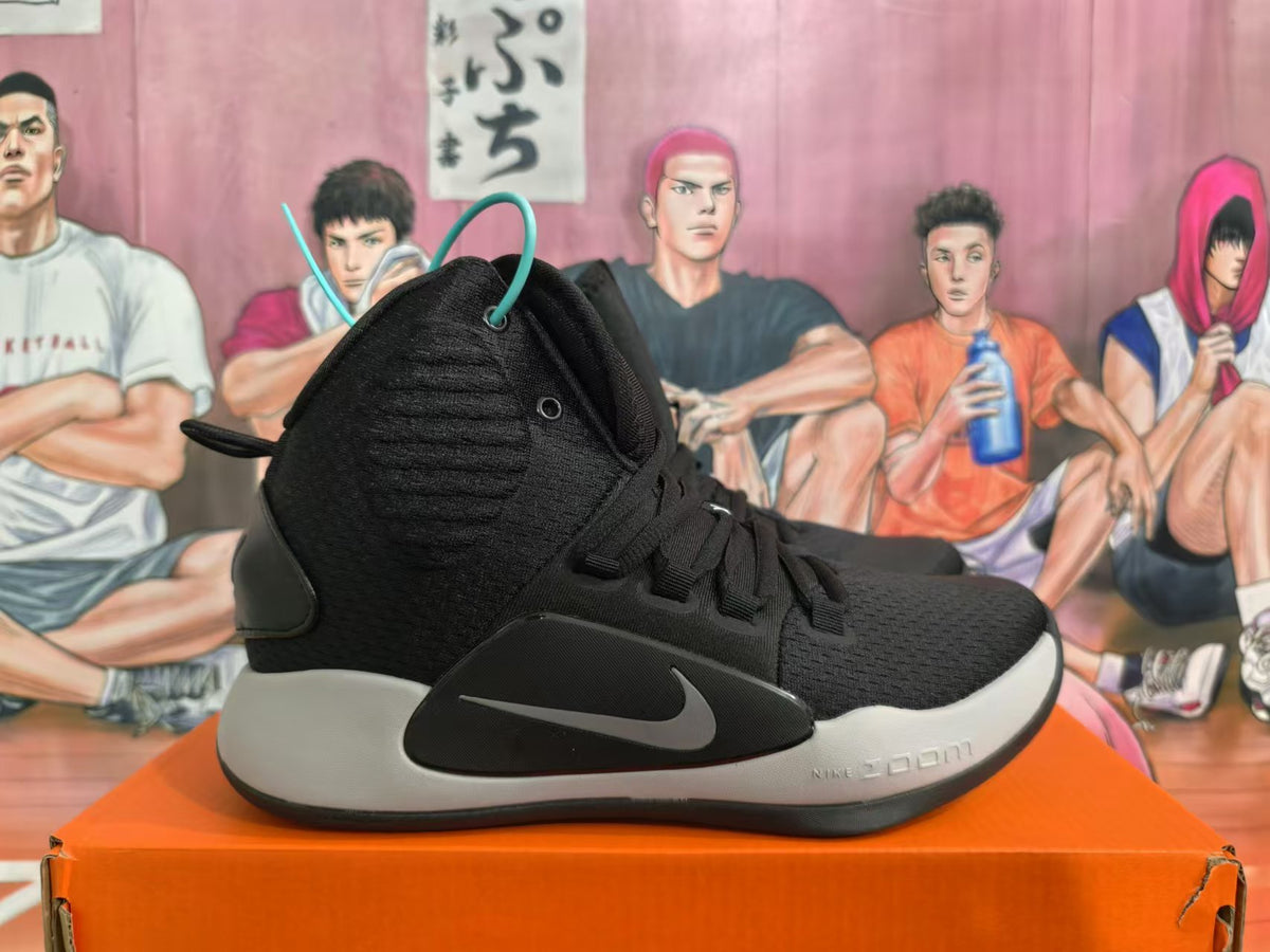 Side view of a black Nike Hyperdunk shoe with grey Swoosh and light-colored midsole