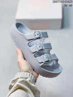 Pale gray Papillio three-strap sandal with adjustable buckles.