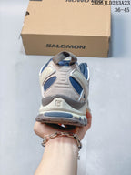 Rear view showing the heel structure and blue lining of the Salomon XA Pro 3D Suede shoe
