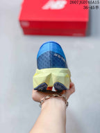 Rear view of the blue running shoe showing the pale yellow midsole, dark blue heel traction sections, and visible ENERGY ARC branding.