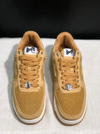 Front view of the pair showing the wheat uppers, perforated toe boxes and white midsoles.