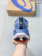Rear view of a blue sneaker showing the padded heel, pull tab, layered heel structure, and visible midsole marking.