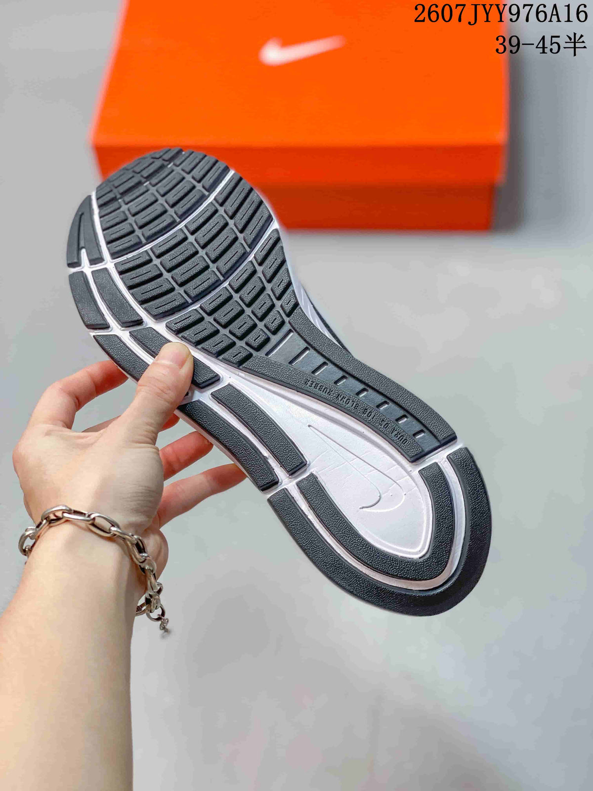 Close view of the sneaker outsole showing segmented black tread and a white midsole section.