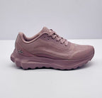 Side profile of a pink alo sneaker showing the lace-up upper, layered midsole, and side branding.