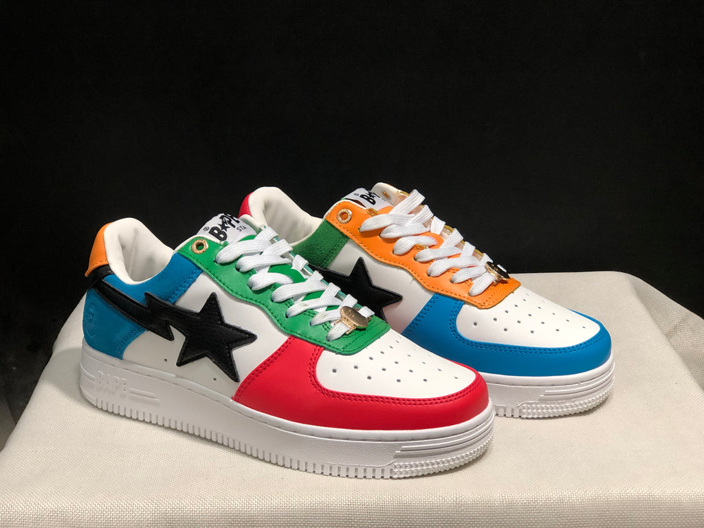 Three-quarter view of both colorful low-top sneakers with white laces and black star-shaped side details.