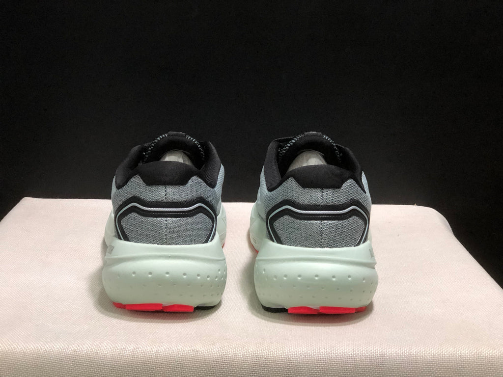 Rear view of the pair showing padded black collars, gray heel panels, and red outsole sections.