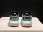 Rear view of the pair showing padded black collars, gray heel panels, and red outsole sections.