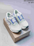 Pair of light green and blue On Cloudmonster 3 sneakers displayed on a box