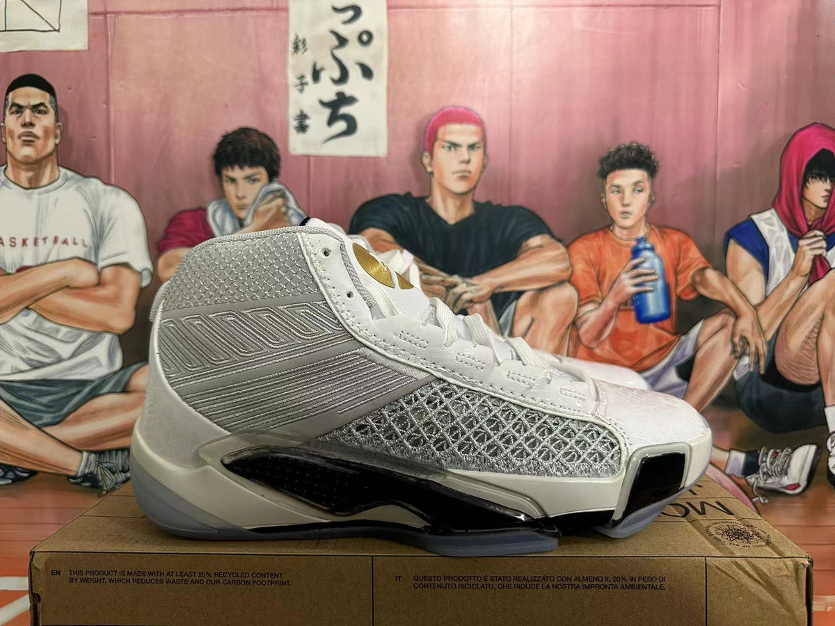 Side view of a white and metallic silver Jordan basketball shoe with patterned panels