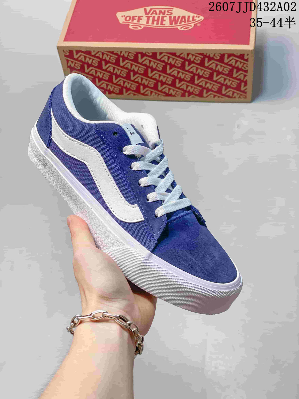 Close view of a blue Vans low-top sneaker with a white side stripe and sole.