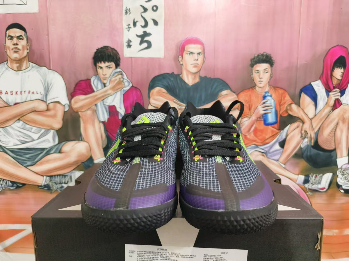 Front view showing the grid-patterned uppers, black laces, and purple toe accents
