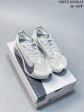 Pair of white and light gray Nike running shoes displayed on a Nike shoe box, with dark navy accents and the code 2607JLD978A18 visible above.