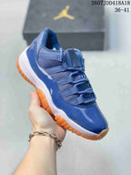 Angled side view of the blue high-top sneaker with glossy panels, tonal laces, white midsole, and translucent orange outsole.
