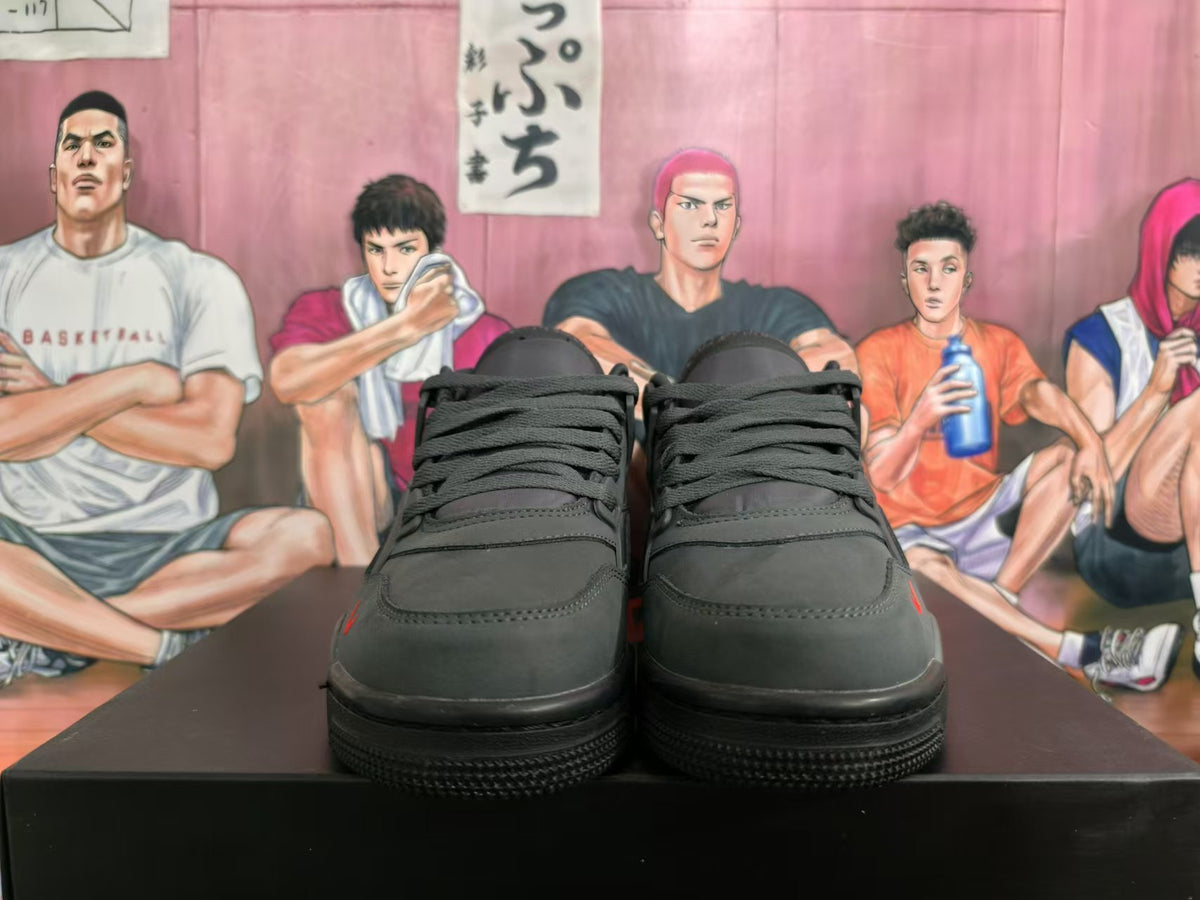 Front view of black Nike basketball sneakers with a lace-up front and dark sole.
