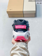 Rear view of the sneaker showing the pink heel tab and white and pink heel details