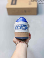 Rear view of the sneaker showing the blue heel tab, textured white heel panel, and blue-outlined lettering.
