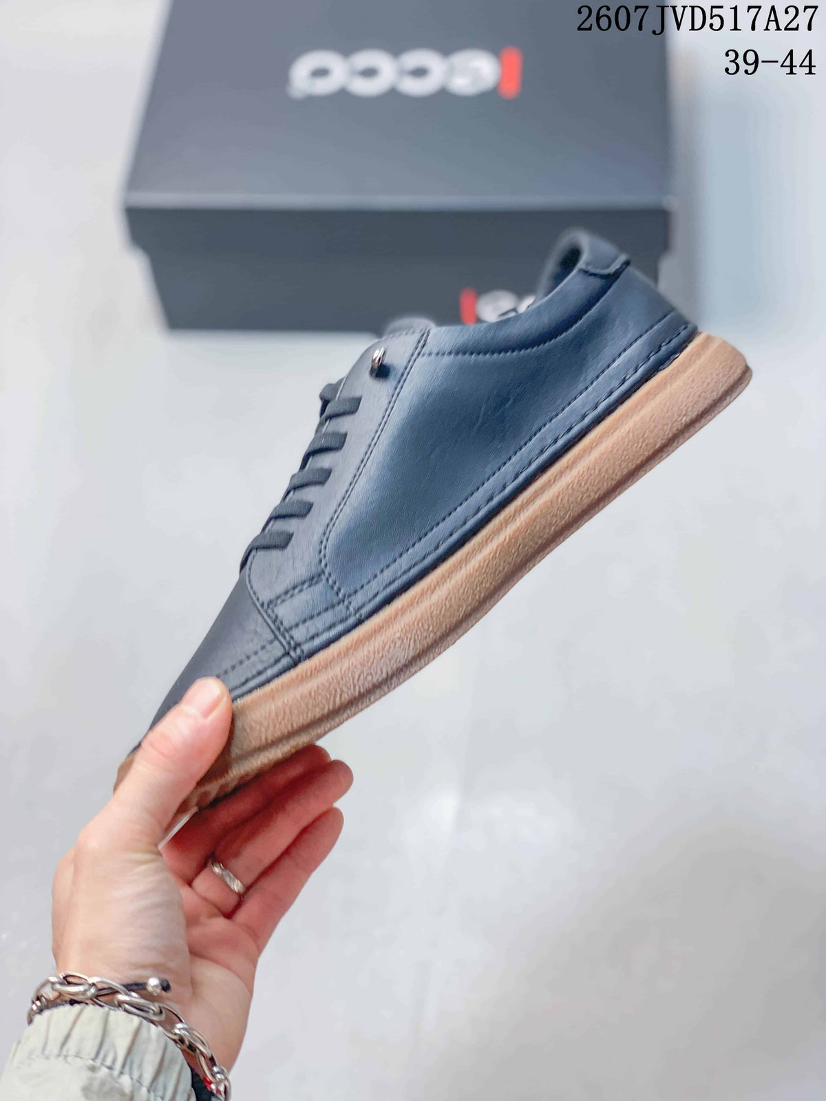 Side profile of the dark navy low-top sneaker showing the stitched upper, lace area, and gum-colored outsole.