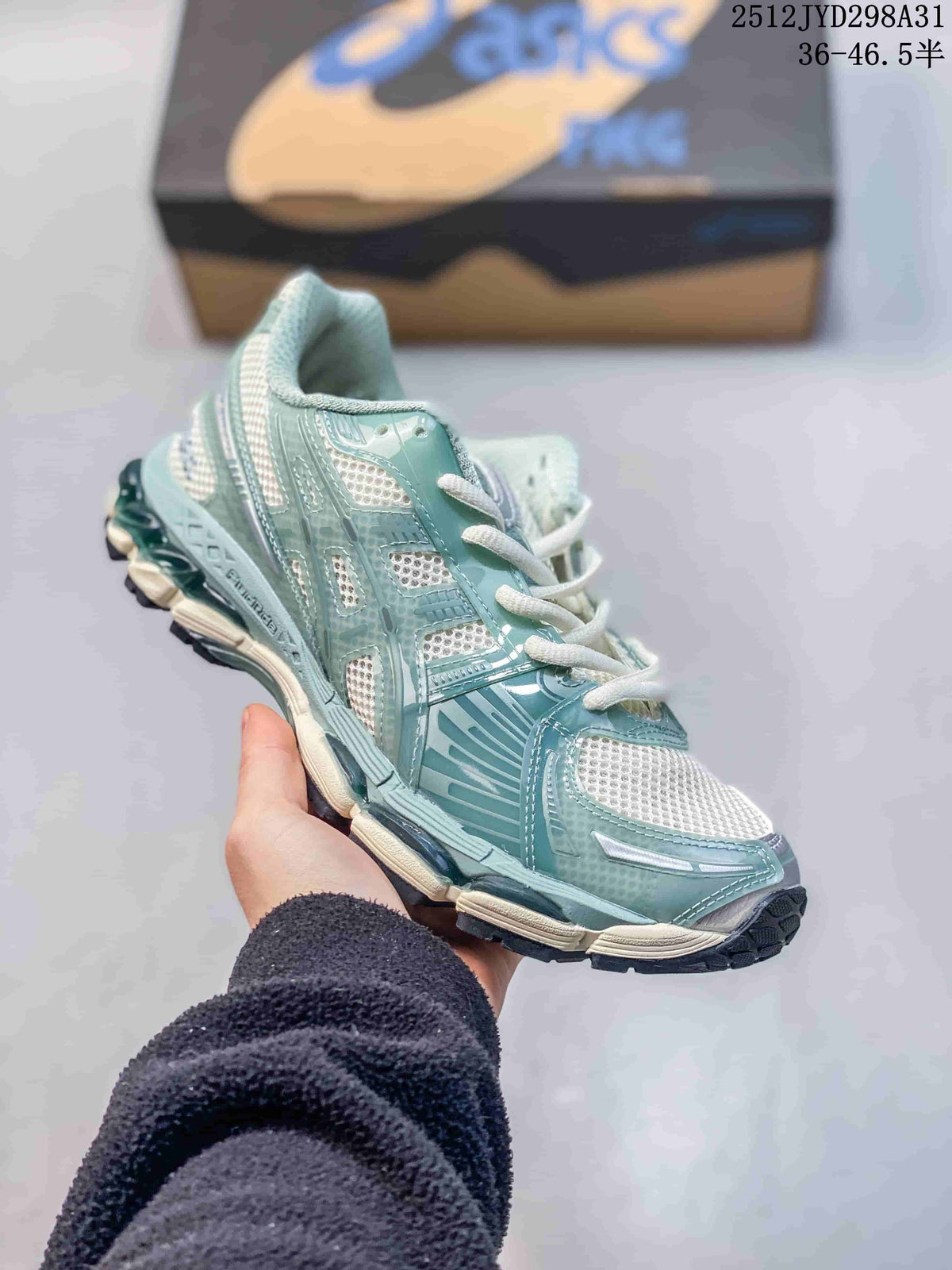 Side view of a pale green and white ASICS Gel-Kayano 12.1 shoe