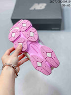 Underside view of the pink outsole showing segmented traction areas and contrasting light-colored inserts.