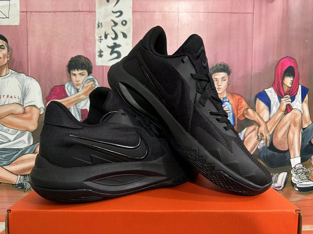 Pair of all-black Nike basketball shoes shown from the side and at an angle.