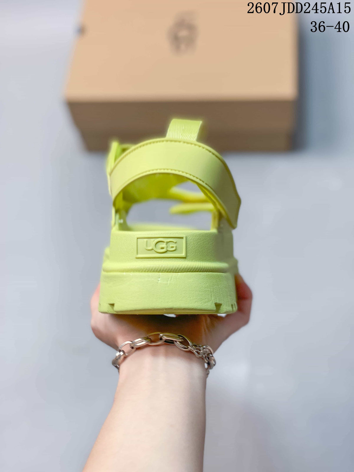 Rear view highlighting the heel strap and embossed UGG branding on the sandal.