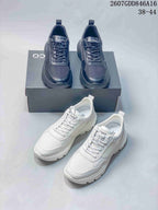 Black and white ECCO sneakers arranged together, showing both color options, lace-up construction and lugged soles.