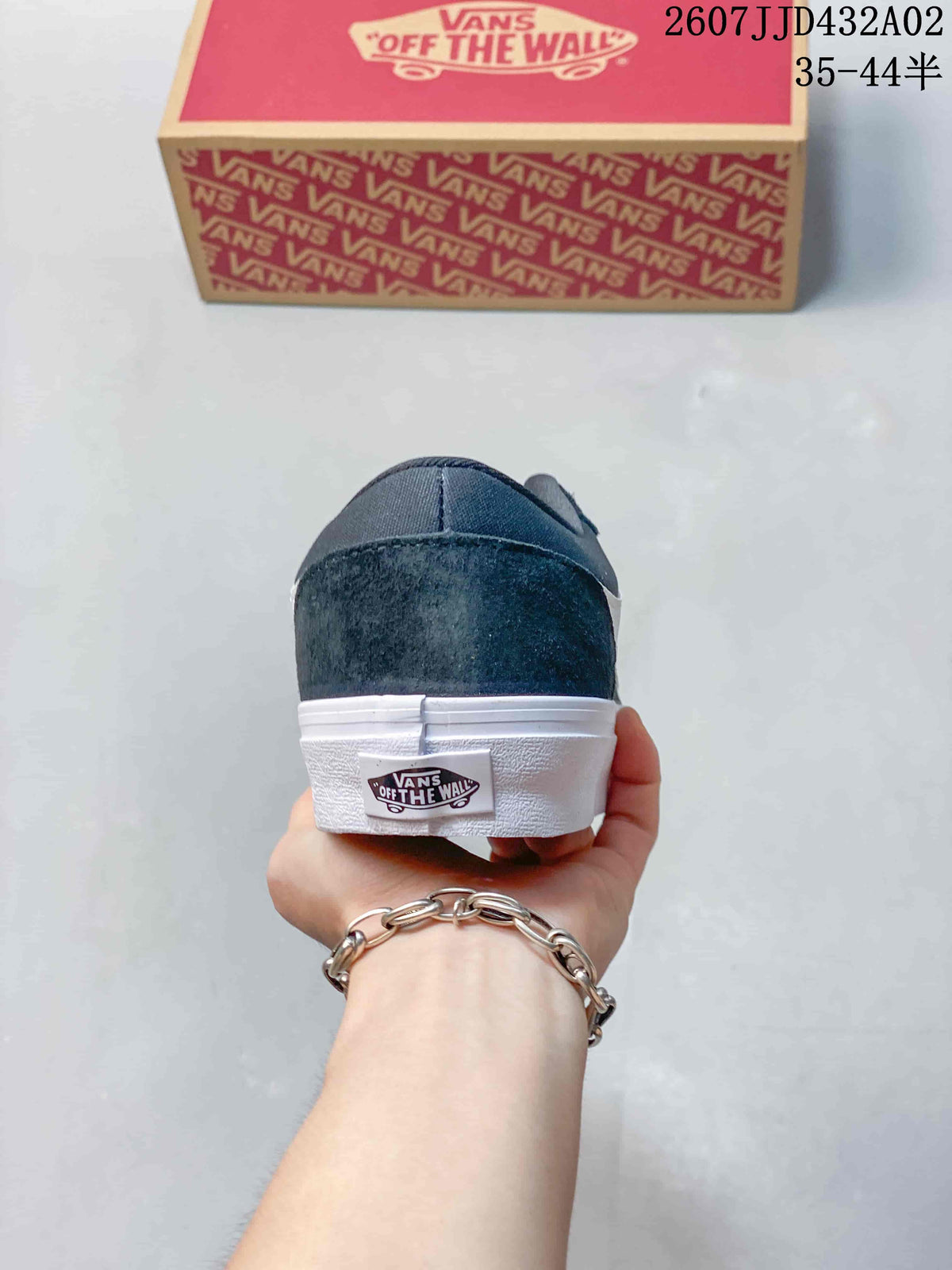 Rear view of a navy low-top sneaker with a white sole