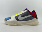 Side profile of the shoe with multicolor panels and beige-colored sole