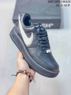 Angled side view showing the black low-top silhouette, white Swoosh, and lace-up construction.