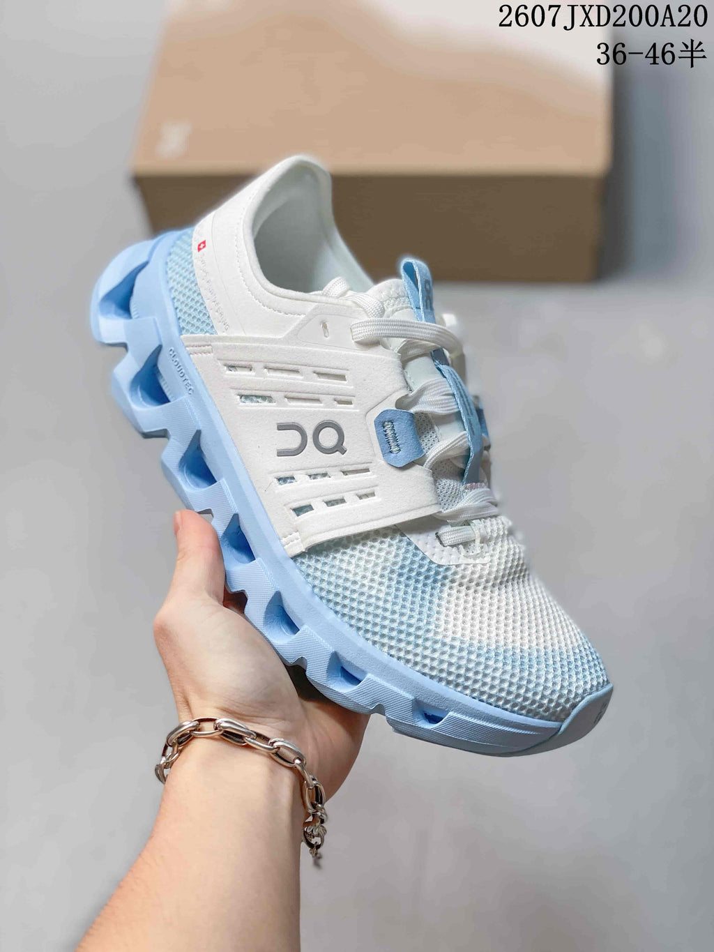 Side view of a white and light blue On Cloudswift Amp sneaker showing the layered upper and sculpted sole.