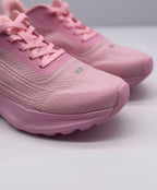 Close-up of the pink sneaker toe box, laces, textured surface, and visible Alo branding.