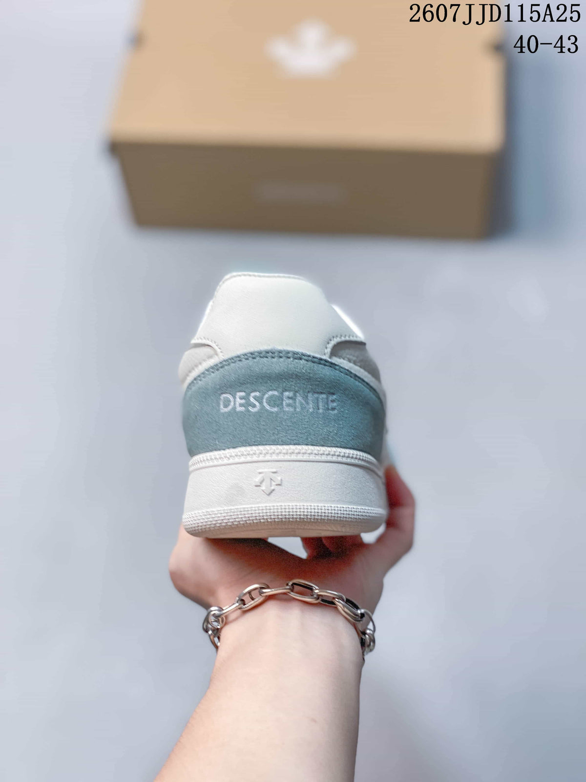 Rear view of the sneaker showing the light blue heel panel, DESCENTE branding, and white midsole.