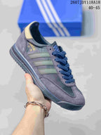 Purple-gray adidas SL 72 sneaker with muted green stripes and dark blue laces.