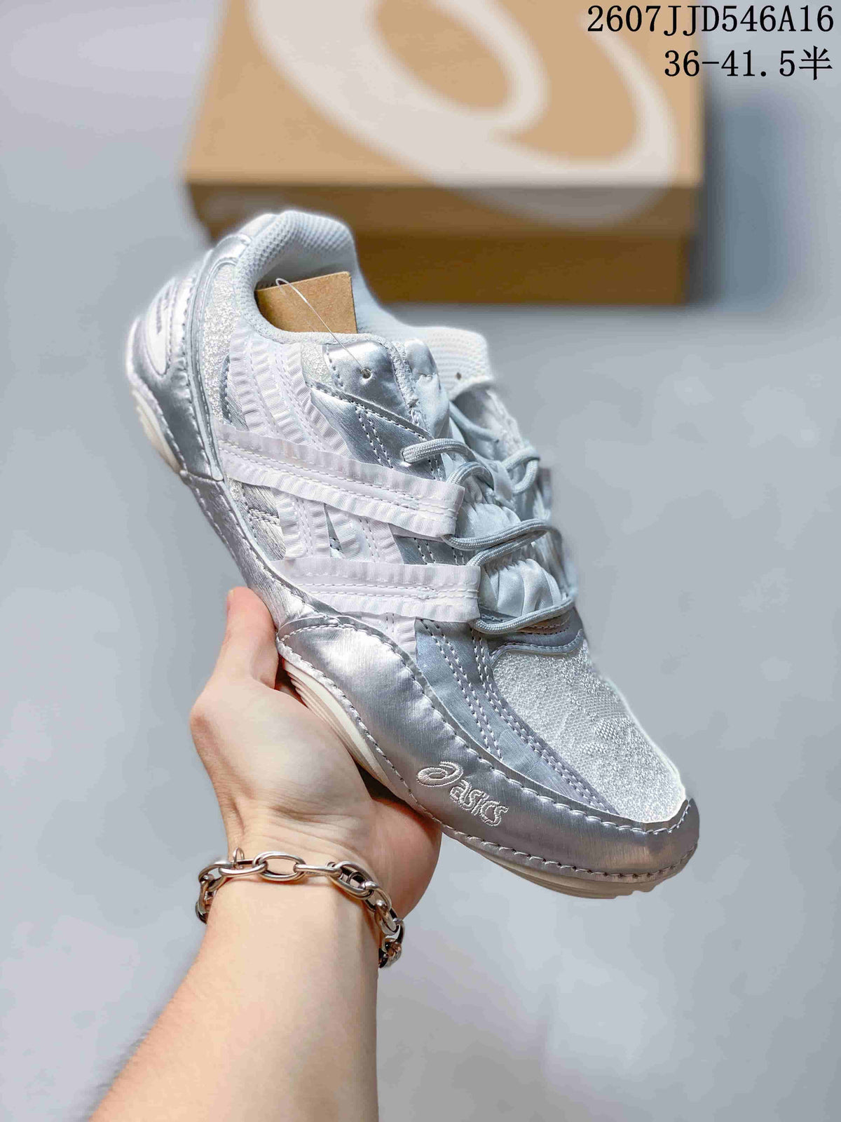 Close side view of a white and silver ASICS Hypersync sneaker showing mesh panels, layered side detailing, and lace-up construction.