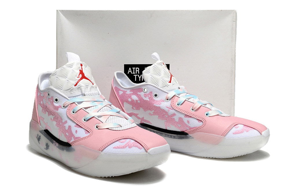 Pink and white Jordan Luka 39 shoes displayed in front of a shoebox