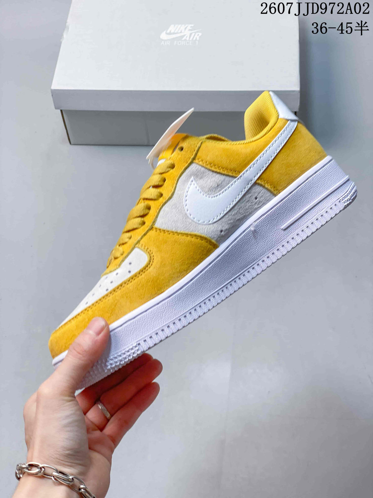 Side view of a yellow and white Nike Air Force 1 low-top sneaker with a white Swoosh and white sole.