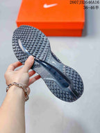 Underside view showing the sneakers’ segmented black traction outsole.