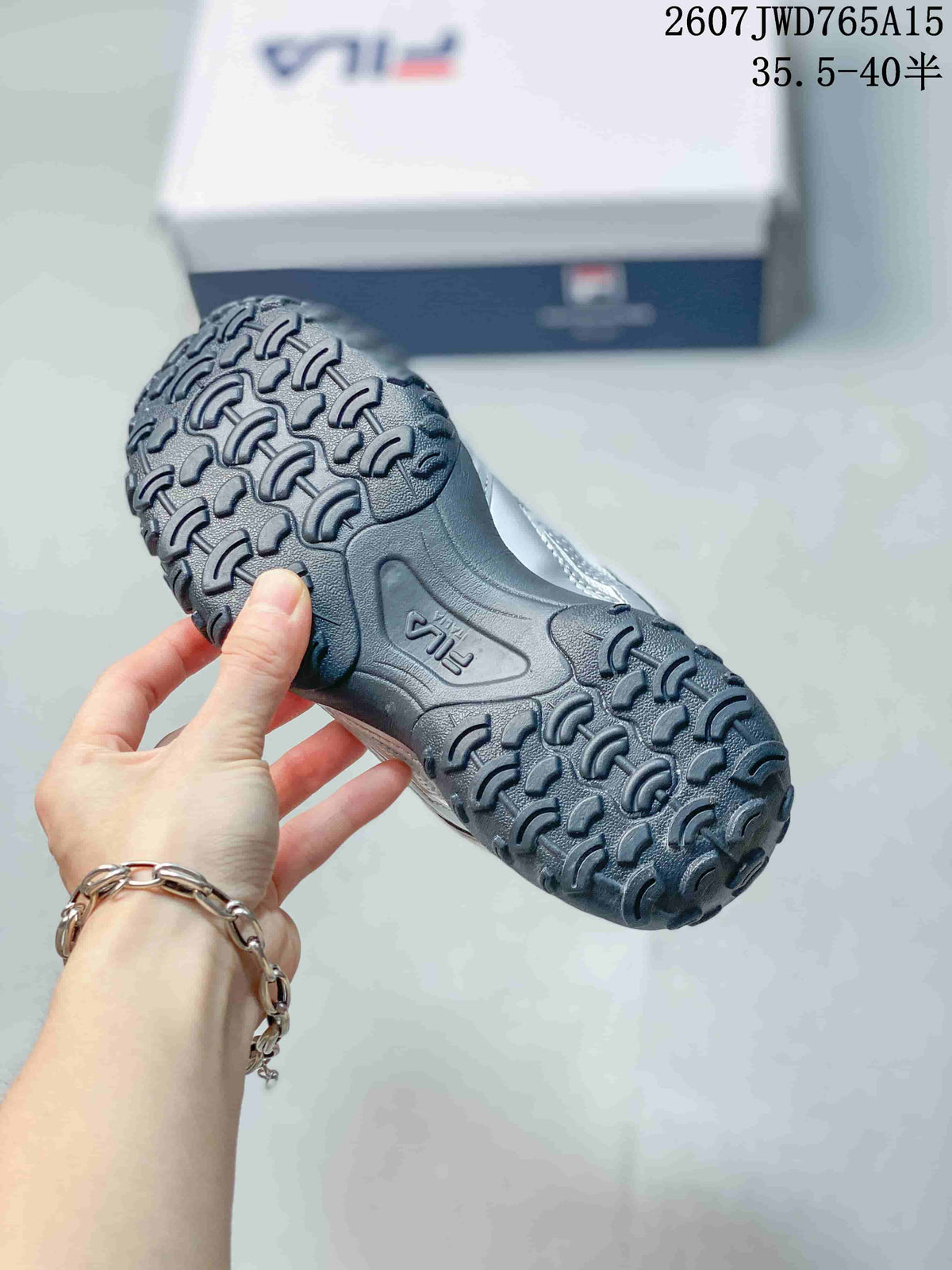 Close view of the black outsole showing its raised repeating tread pattern.