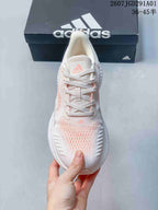 Top view showing the laces, tongue, and pale pink detailing