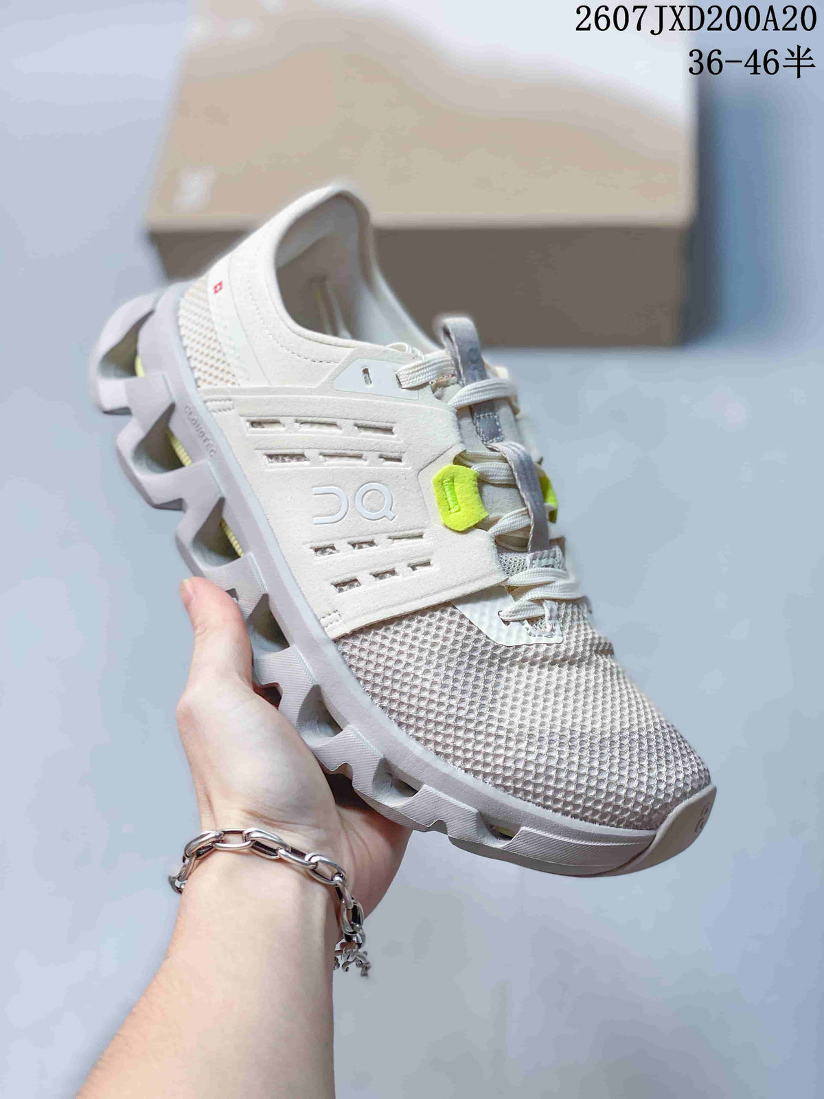 Angled side view showing the white mesh upper, On branding, lace system, and sculpted outsole.