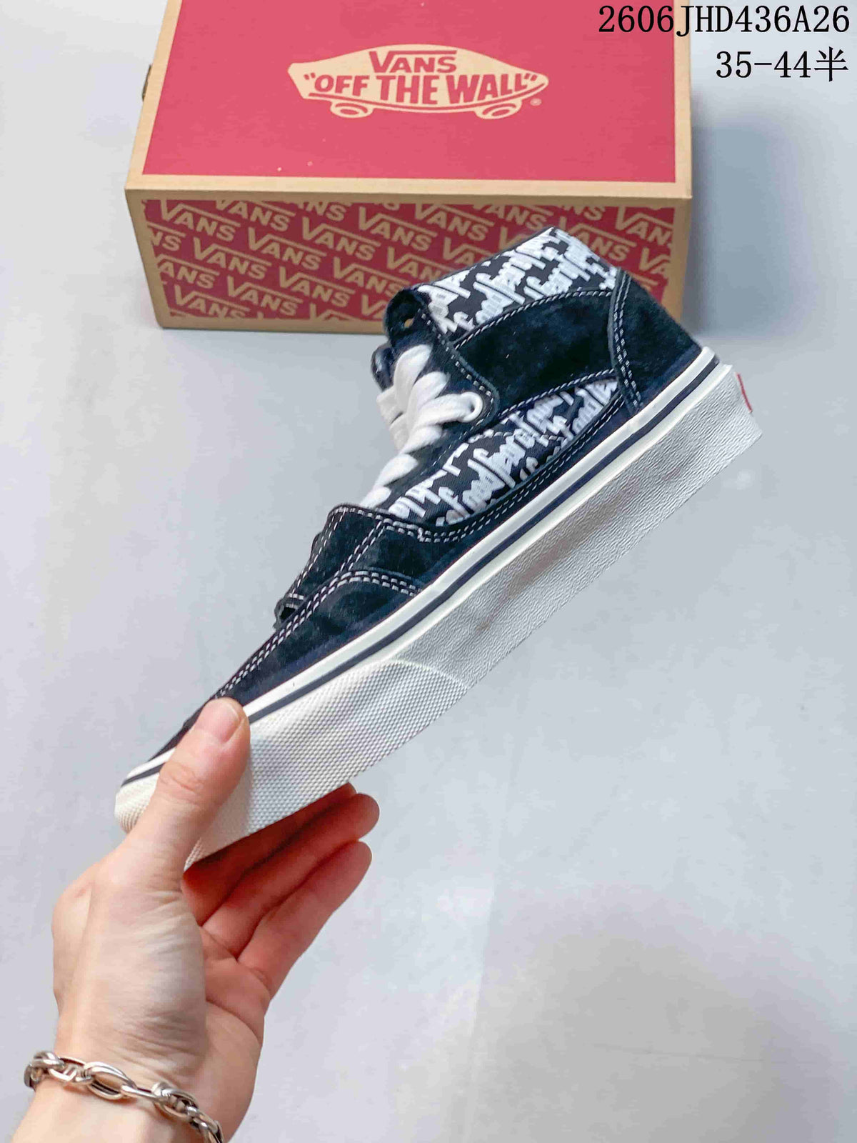 Side view of the black-and-white text-patterned Vans sneaker with a white sole.