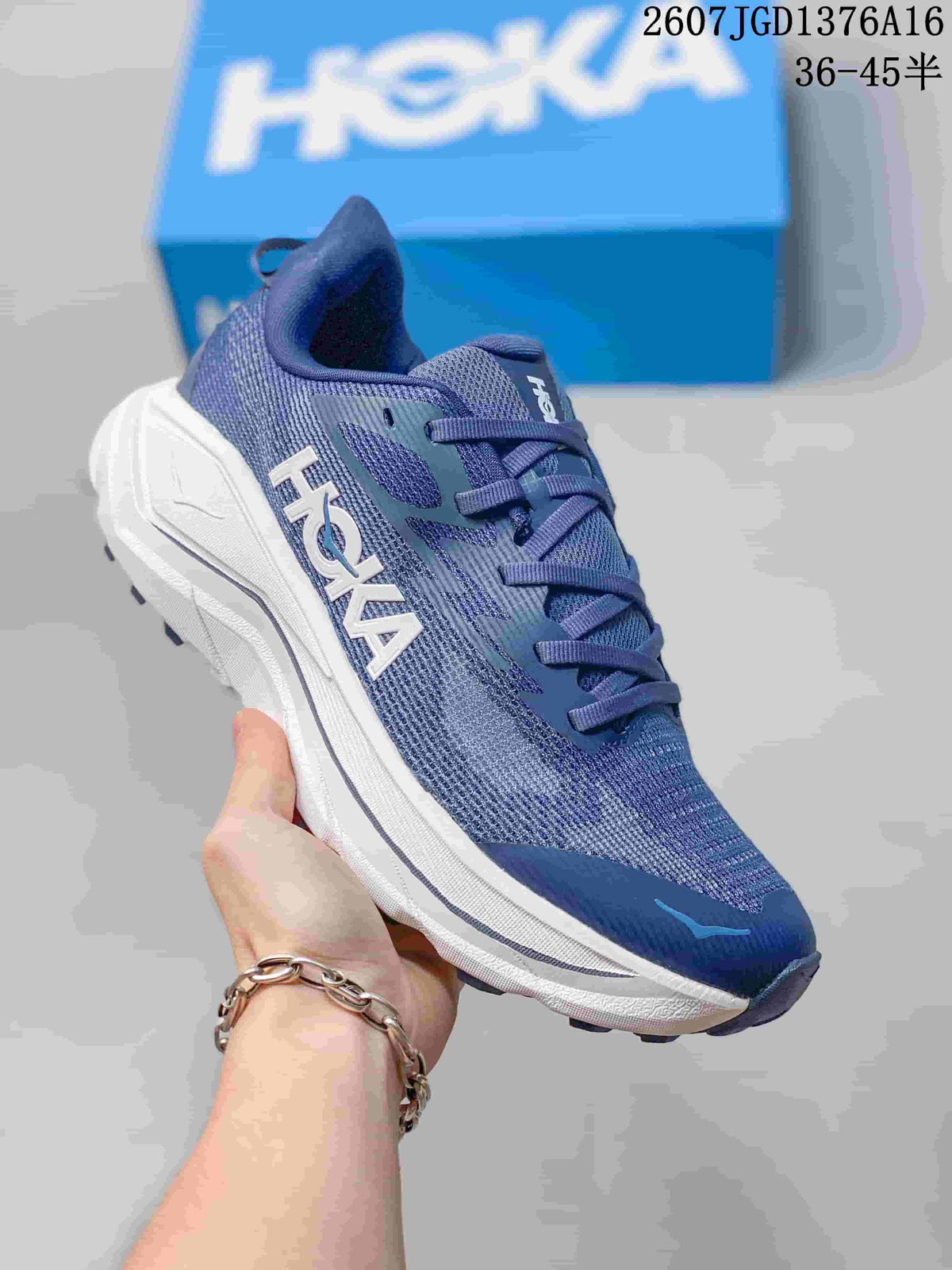 Angled side view of the blue HOKA Challenger 8 shoe showing the HOKA branding and layered white midsole.