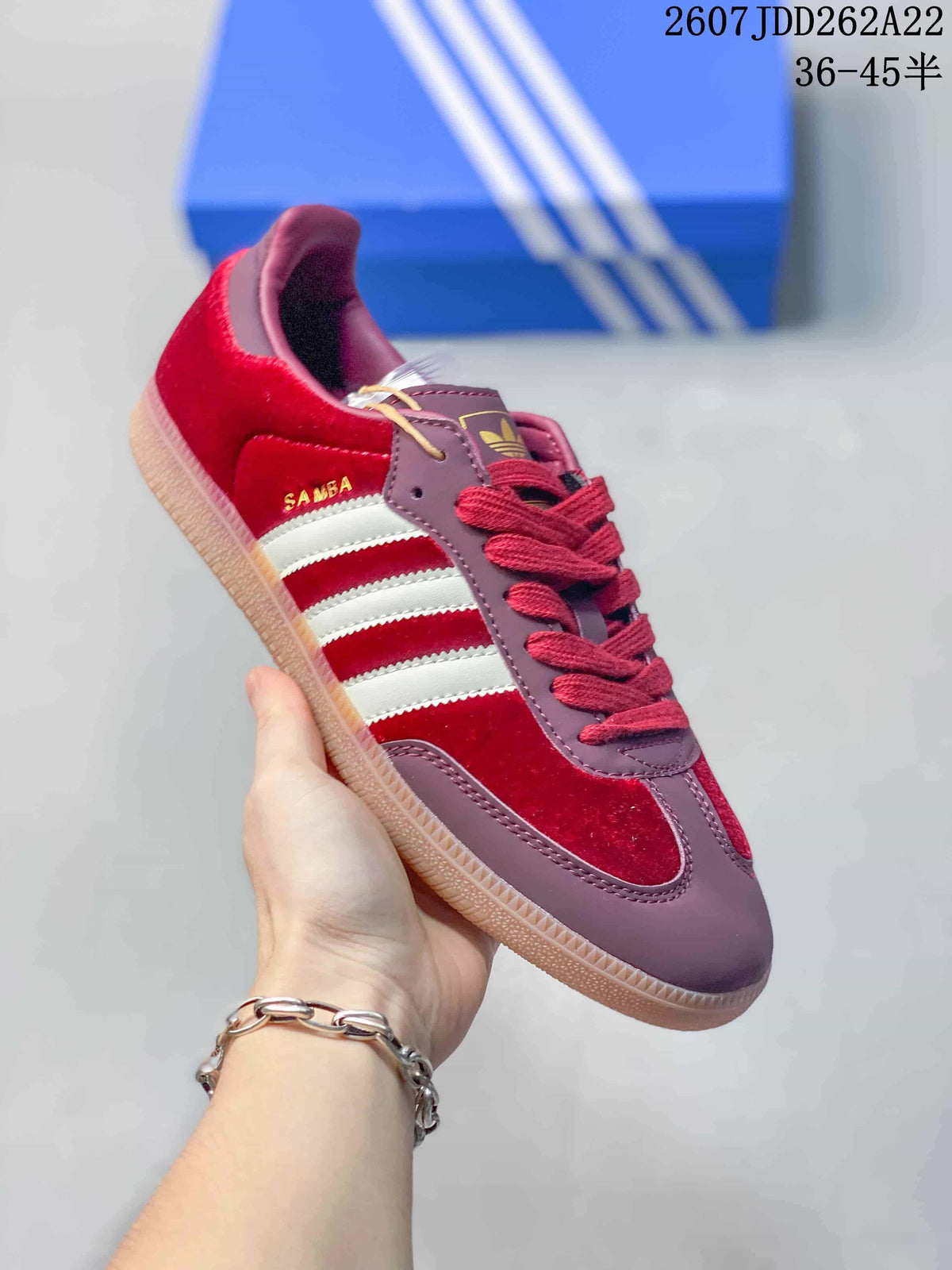 Angled side view showing the Samba side detail, white stripes, burgundy panels, and gum outsole.
