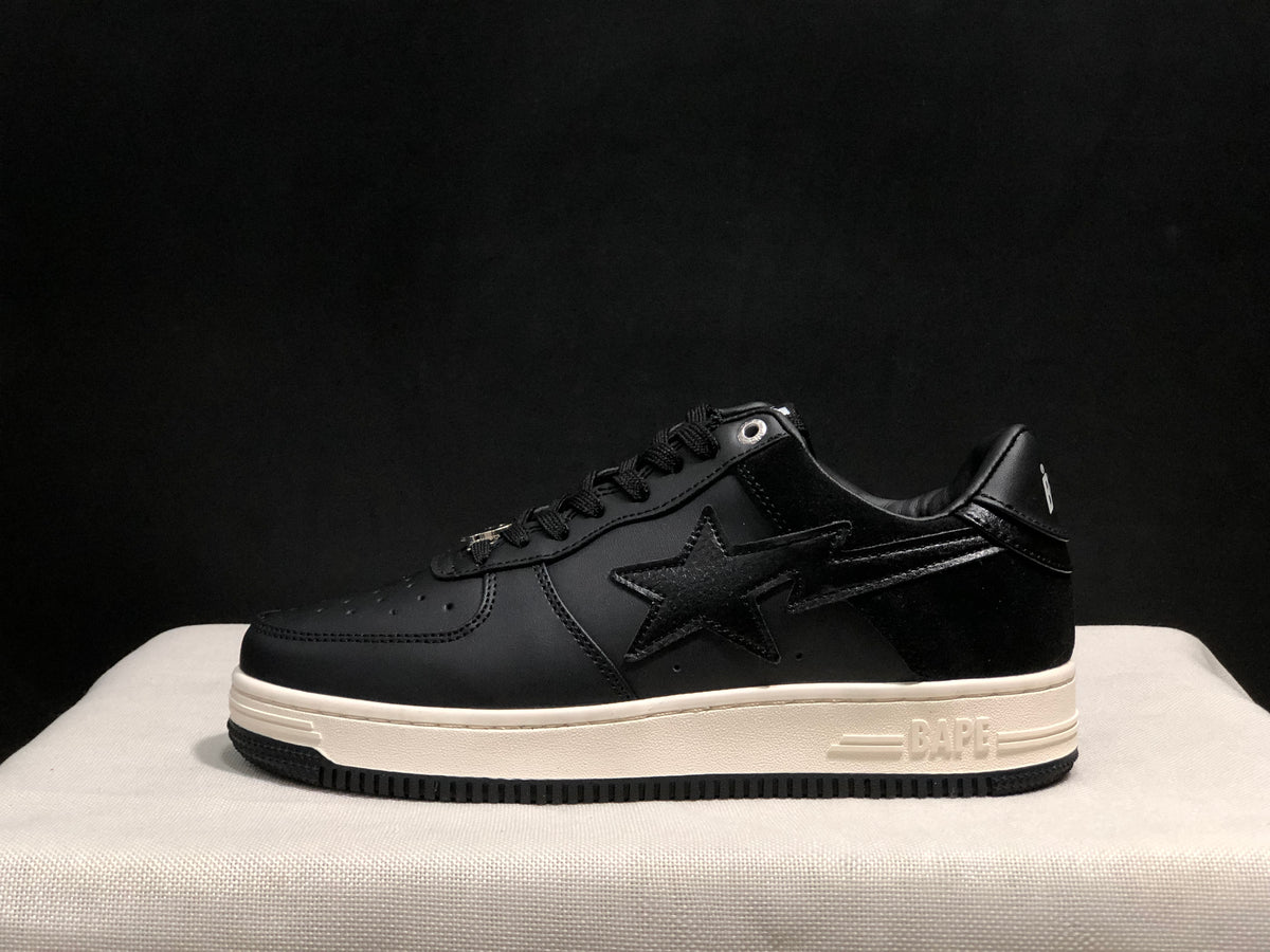 Side profile showing the black low-top sneaker, star side detail, white midsole, and black outsole.