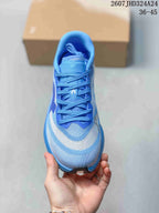 Top view of the blue lace-up running shoe showing the tongue, laces, padded collar, and contrasting toe panels; image text shows style code 2607JHD324A24 and size range 36–45.