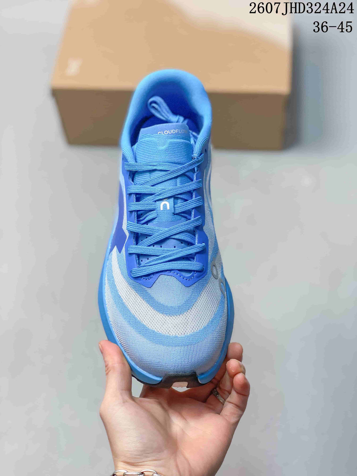 Top view of the blue lace-up running shoe showing the tongue, laces, padded collar, and contrasting toe panels; image text shows style code 2607JHD324A24 and size range 36–45.