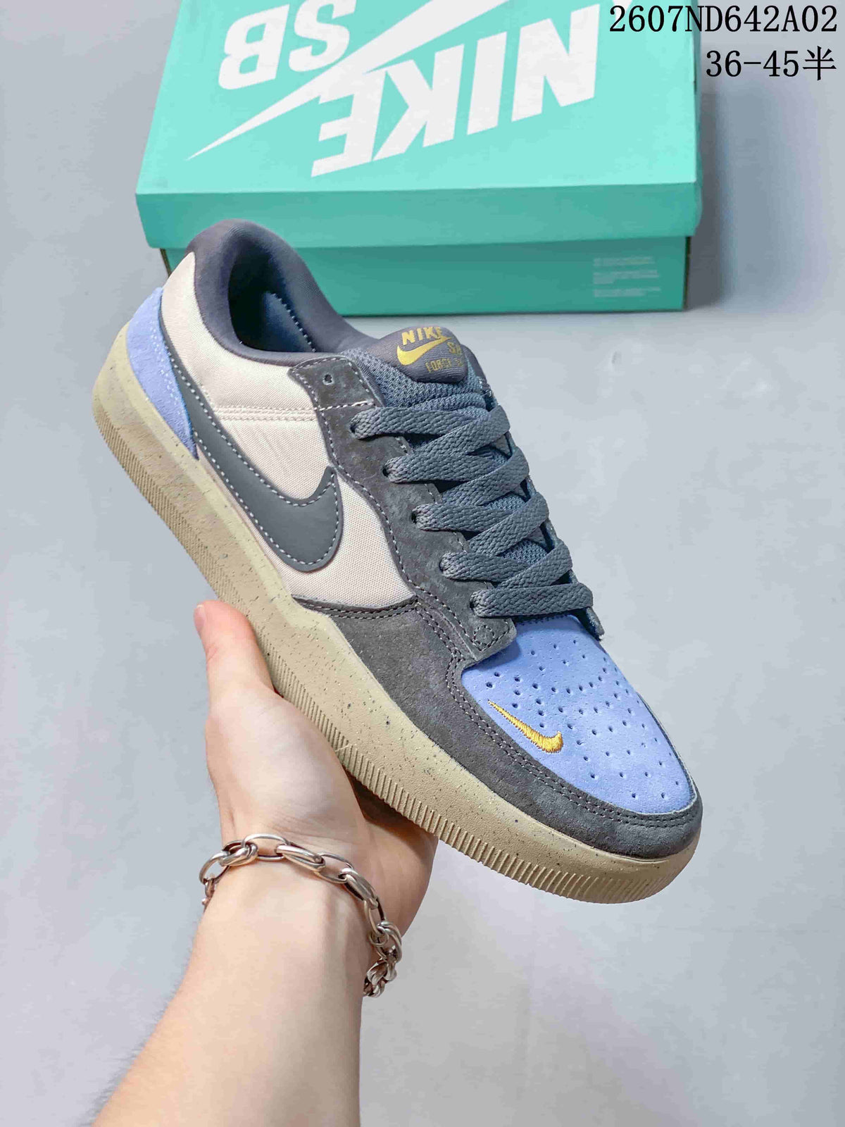 Angled view of a Nike SB Force 58 shoe showing its multicolor panels and low-top shape