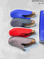 Top-down view of blue, gray, red, and gray-pink clogs arranged beside the product box.