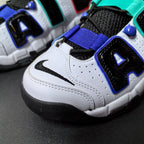 Close-up of the perforated white toe, black Swoosh, and blue-accented side lettering